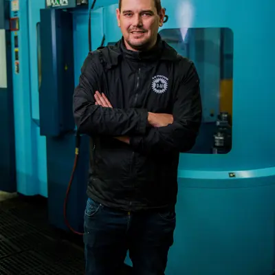 Man standing in front of a machine