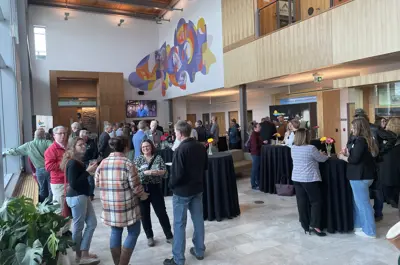 A group of people gathering at a banquet 