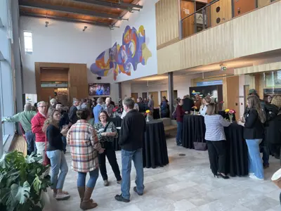 A group of people gathering at a banquet 