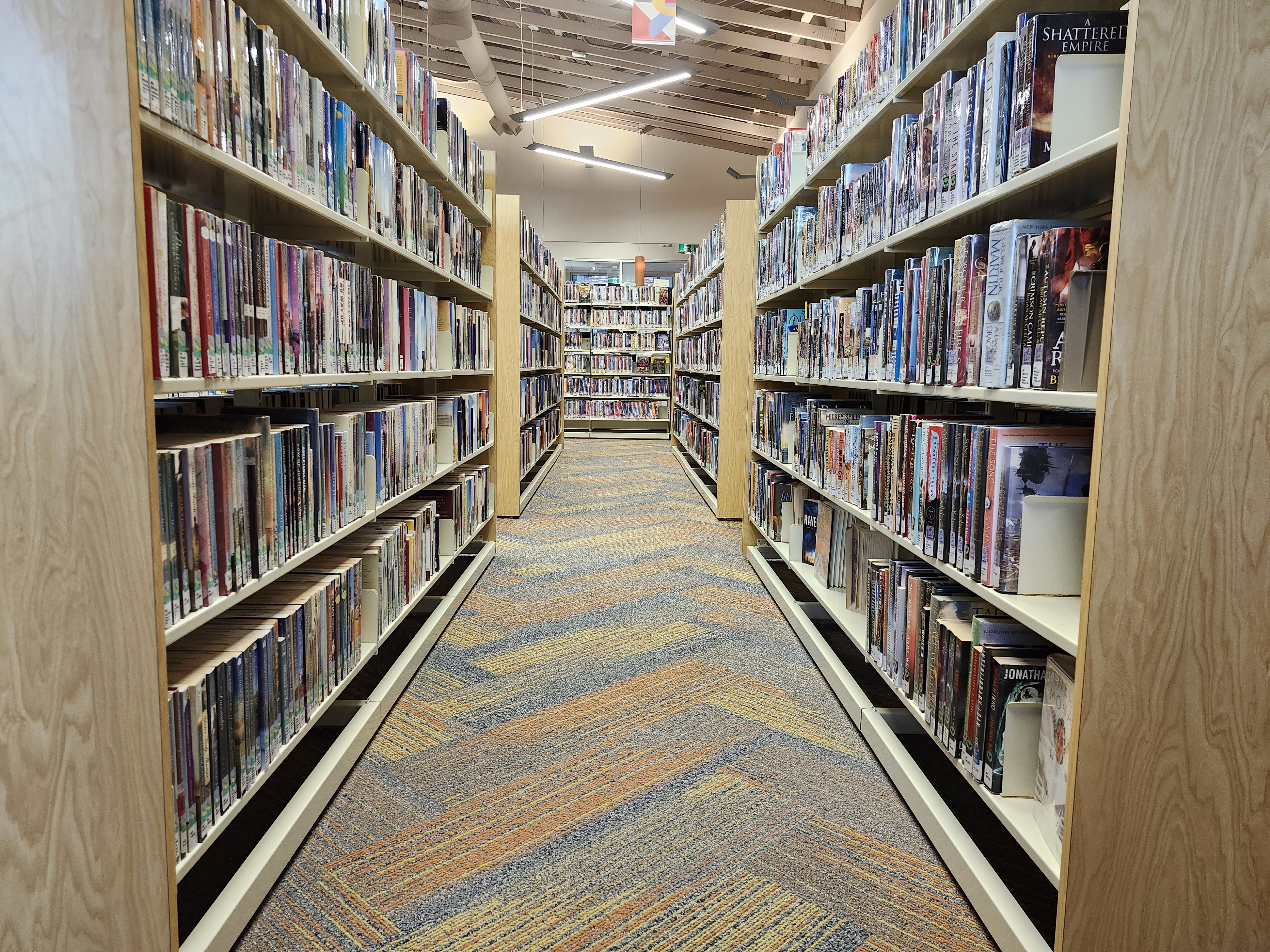 View Down Aisle Of Bookshelves at the Cayuga Library 