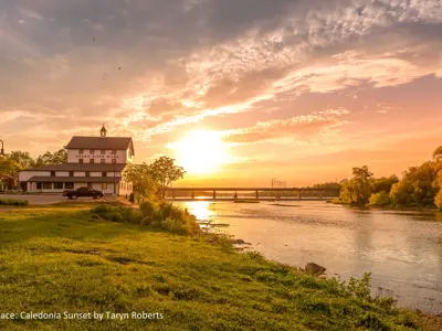 2021 1st Place Photo - Magic hour sunset behind the Grand River Mills building along the grand river, taken by Taryn Roberts