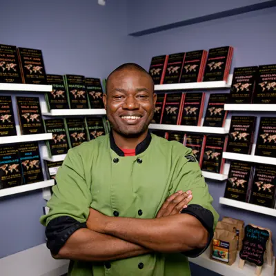 Man standing in front of chocolate bars