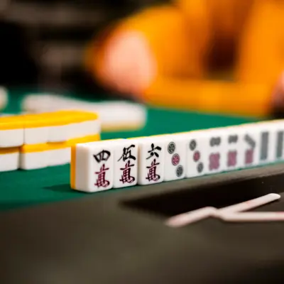 Close up of mah jongg tiles on a table